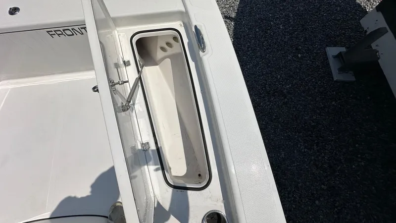 Slide: The Image of 2024 Frontier 2104 boat storage compartment open. - 14