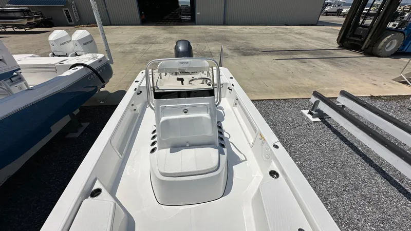 Slide: The Image of 2024 Frontier 2104 boat, white interior, docked at a marina. - 5