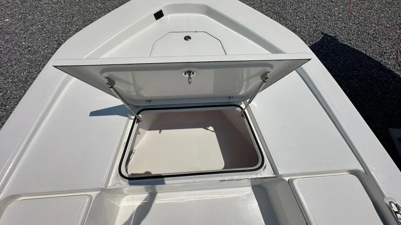 Slide: The Image of 2024 Frontier 2104 boat with open storage compartment. - 7