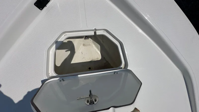 Slide: The Image of Open storage compartment on a 2024 Frontier 2104 boat. - 8