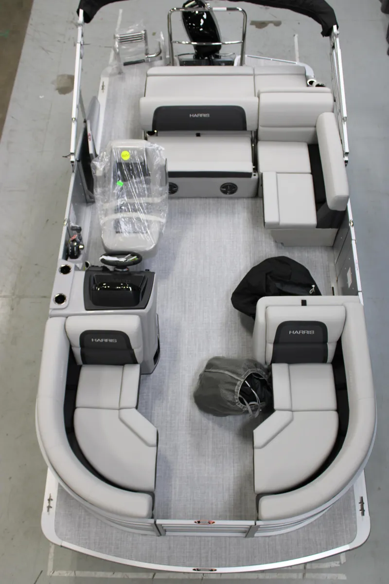 Slide: The Image of 2025 Harris Cruiser 190 pontoon boat with spacious seating and modern design. - 2