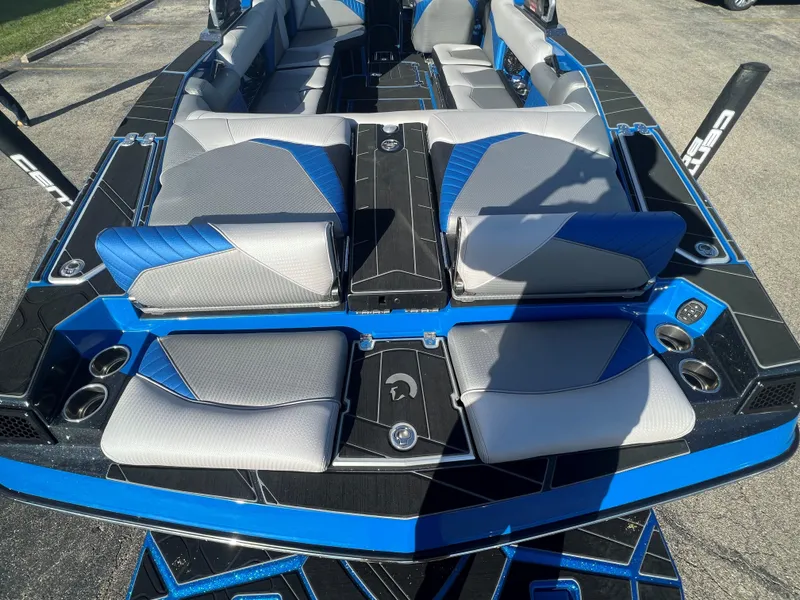 Slide: The Image of 2023 Centurion Fi25 boat interior with blue and gray seating. - 10