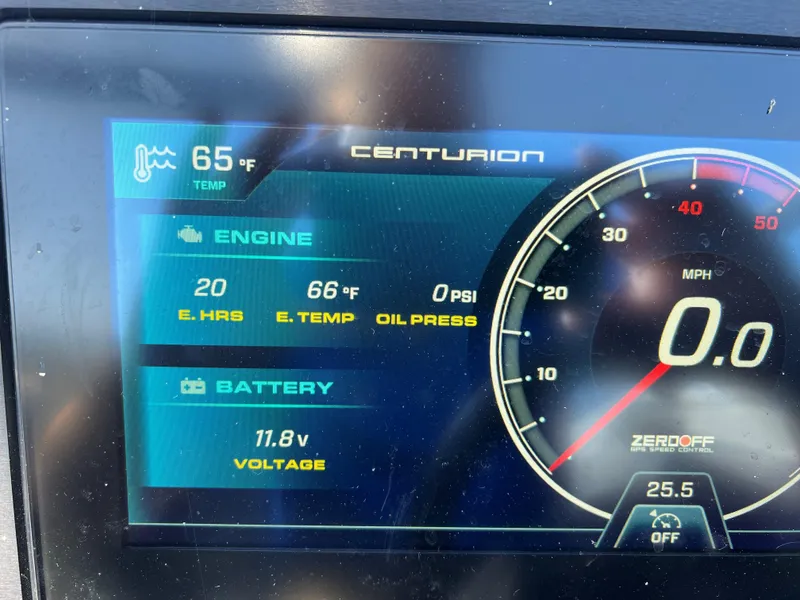 Slide: The Image of 2023 Centurion Fi25 dashboard display showing engine hours, temperature, oil pressure, and battery voltage. - 6