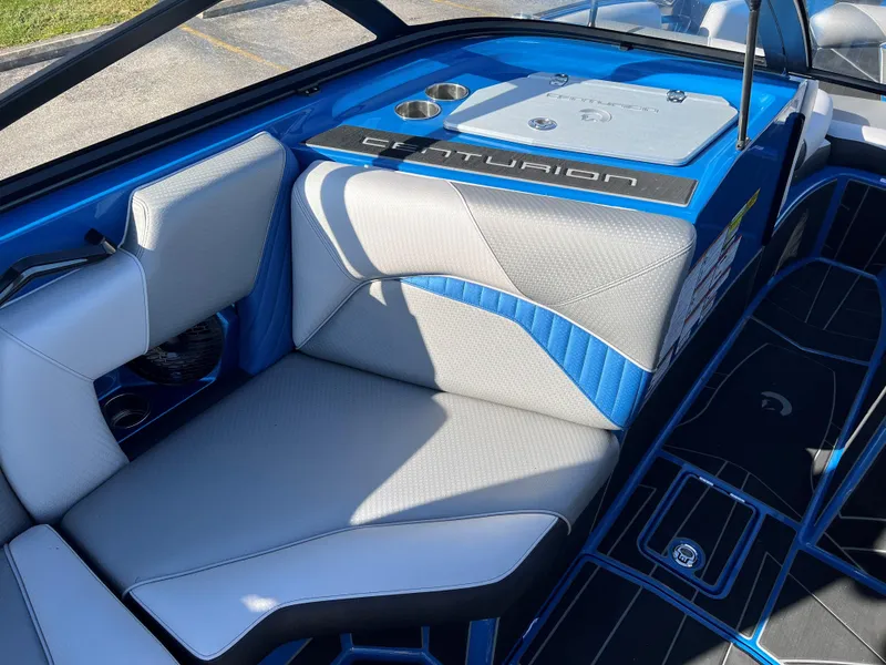 Slide: The Image of 2023 Centurion Fi25 boat interior with blue and gray seating. - 9