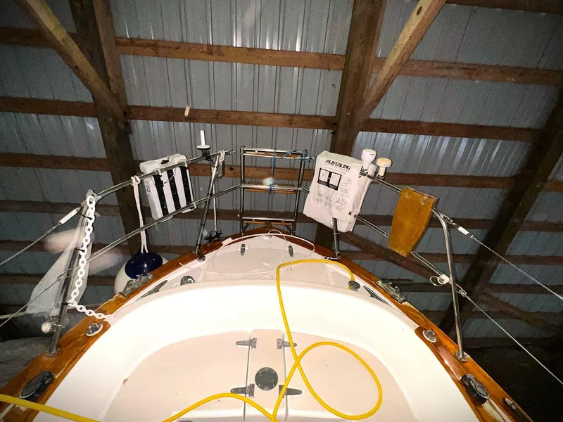 Slide: The Image of Pacific Seacraft 37 sailboat, 2000 model, docked indoors with nautical equipment. - 11