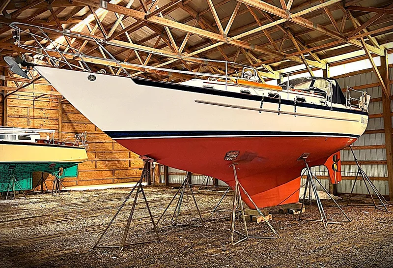 Slide: The Image of Pacific Seacraft 37 sailboat, 2000 model, stored in a wooden boathouse. - 13