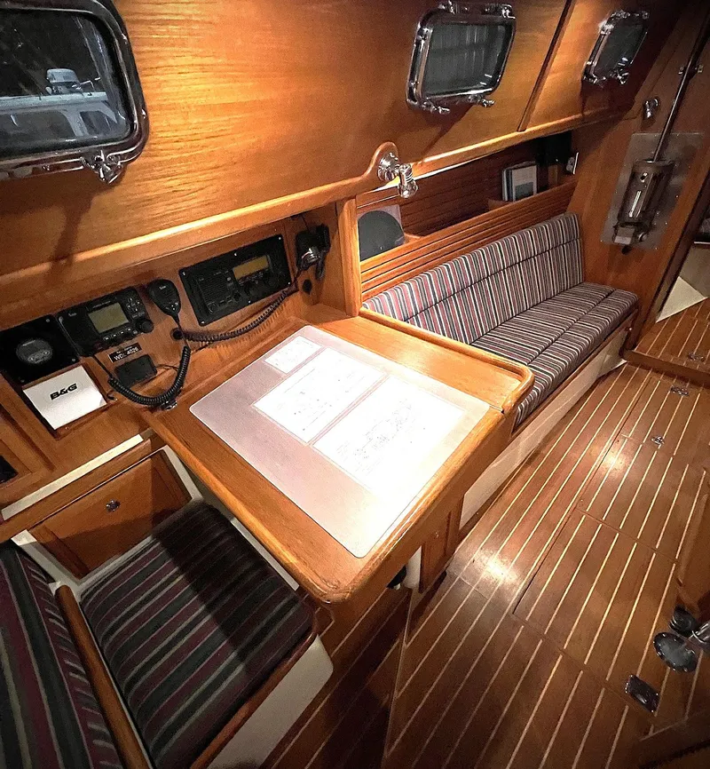 Slide: The Image of Interior of 2000 Pacific Seacraft 37 sailboat with wood finish and navigation station. - 4