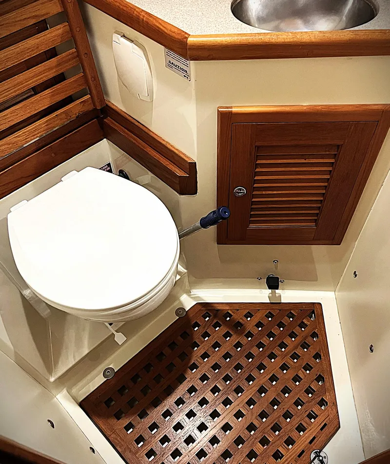 Slide: The Image of Pacific Seacraft 37 yacht bathroom with wooden accents, 2000 model. - 7