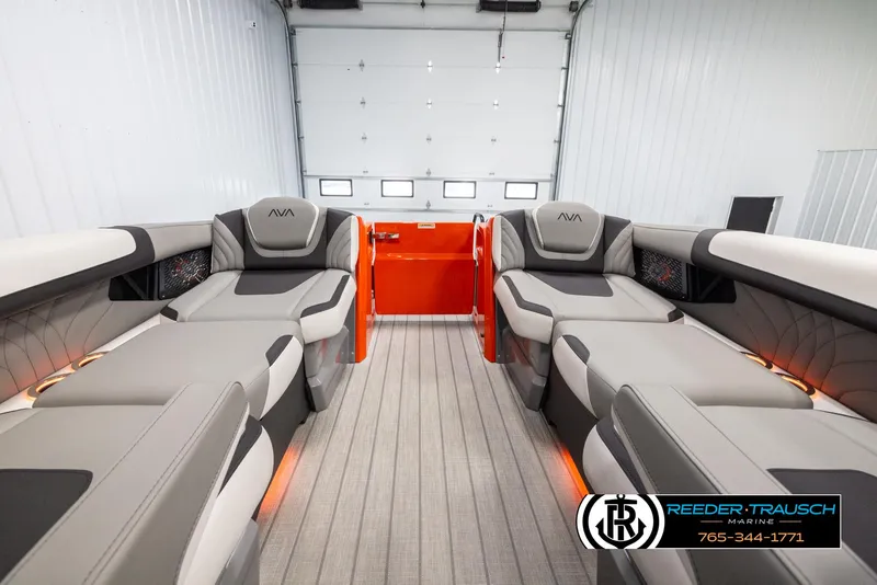 Slide: The Image of 2024 Avalon Excalibur VRB luxury boat interior with plush seating and ambient lighting. - 19