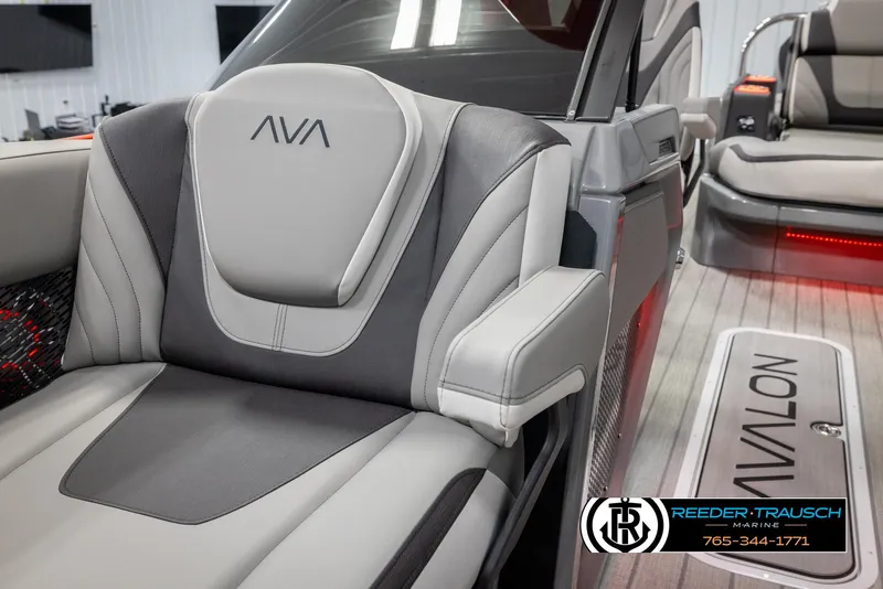 Slide: The Image of 2024 Avalon Excalibur VRB luxury boat interior with gray and white seating. - 21