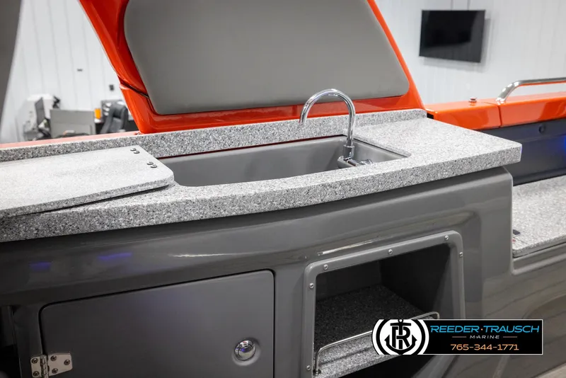 Slide: The Image of 2024 Avalon Excalibur VRB boat interior with sink and storage compartments. - 26