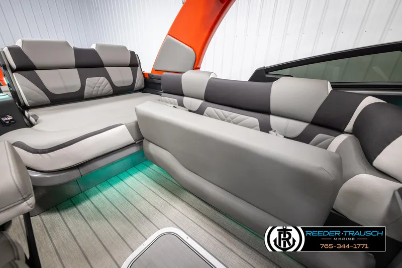Slide: The Image of 2024 Avalon Excalibur VRB boat interior with modern seating and ambient lighting. - 28