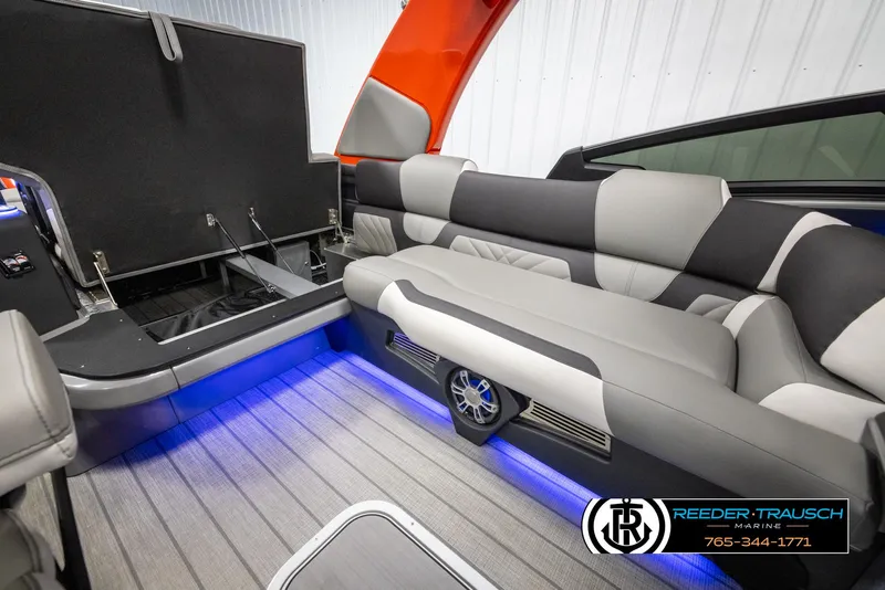 Slide: The Image of 2024 Avalon Excalibur VRB boat interior with LED lighting and luxury seating. - 29