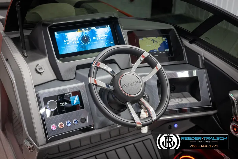 Slide: The Image of 2024 Avalon Excalibur VRB boat dashboard with advanced navigation and control systems. - 35