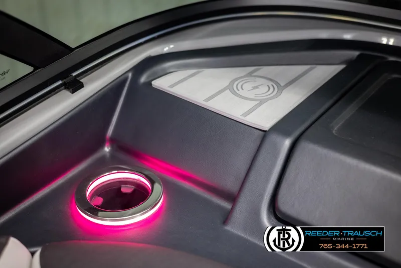 Slide: The Image of 2024 Avalon Excalibur VRB interior with illuminated cup holder and logo. - 49