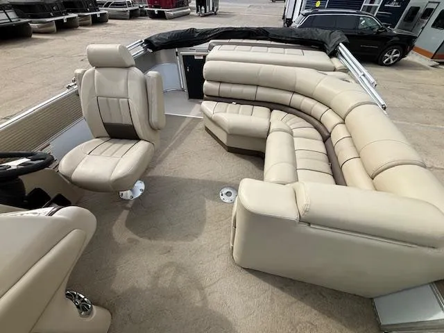 Slide: The Image of 2014 Starcraft Limited 236 boat interior with beige leather seating. - 13