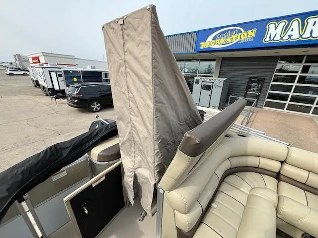 Slide: The Image of 2014 Starcraft Limited 236 pontoon boat interior at a dealership. - 15