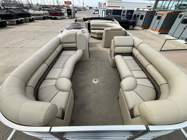 Slide: The Image of 2014 Starcraft Limited 236 pontoon boat with spacious seating and beige upholstery. - 7
