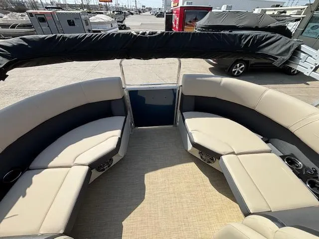 Slide: The Image of 2024 Harris Cruiser 230 CWDH pontoon boat with spacious seating and modern design. - 13