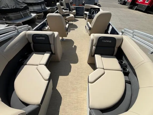 Slide: The Image of 2024 Harris Cruiser 230 CWDH pontoon boat with beige and gray seating. - 14