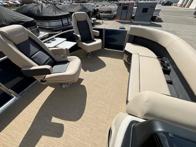 Slide: The Image of 2024 Harris Cruiser 230 CWDH pontoon boat interior with beige seating and spacious layout. - 22
