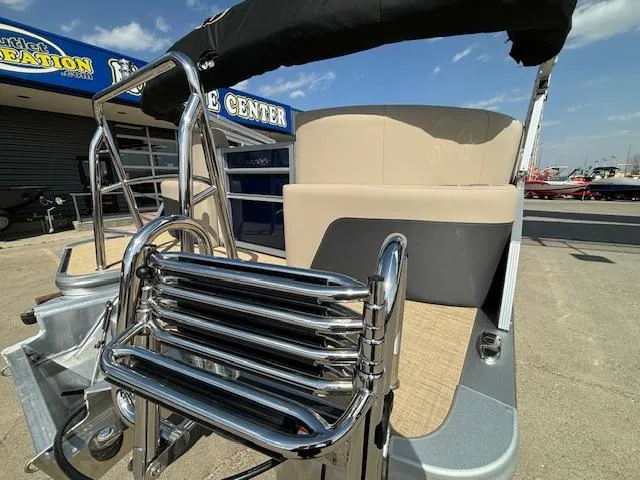Slide: The Image of 2024 Harris Cruiser 230 CWDH pontoon boat rear view with stainless steel ladder. - 5
