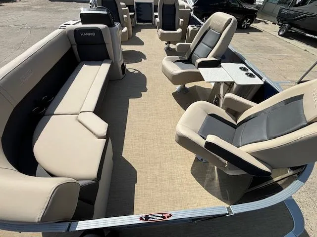 Slide: The Image of 2024 Harris Cruiser 230 CWDH pontoon boat interior with beige and gray seating. - 7