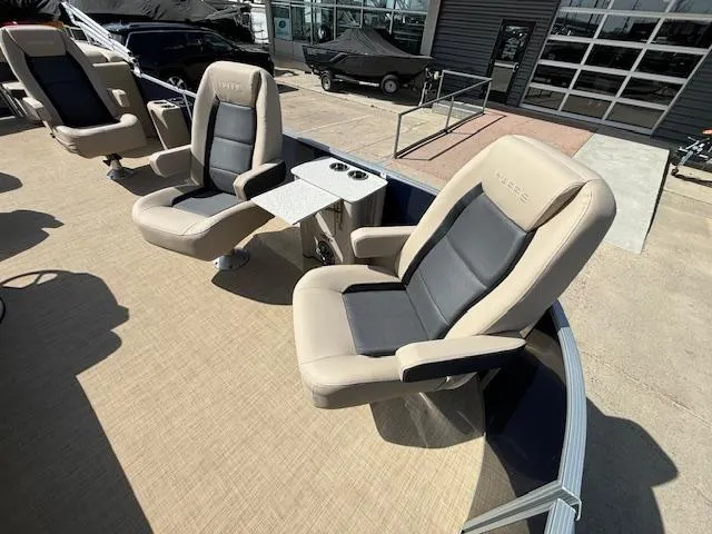 Slide: The Image of 2024 Harris Cruiser 230 CWDH boat with beige and black seating. - 8