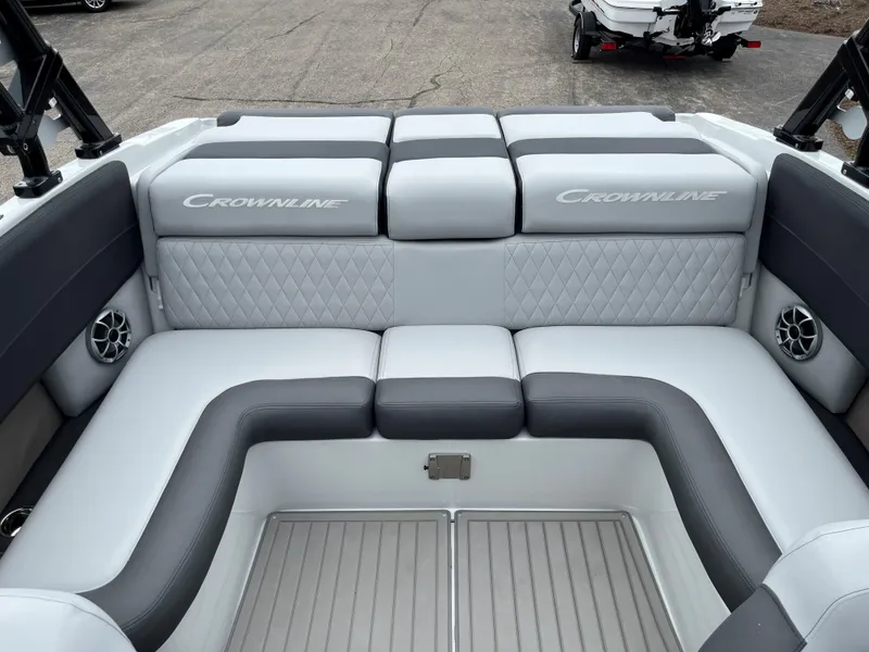 Slide: The Image of 2025 Crownline 240 SS boat interior with cushioned seating. - 10