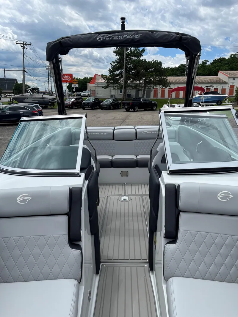 Slide: The Image of 2025 Crownline 240 SS boat interior with open bow and luxury seating. - 5