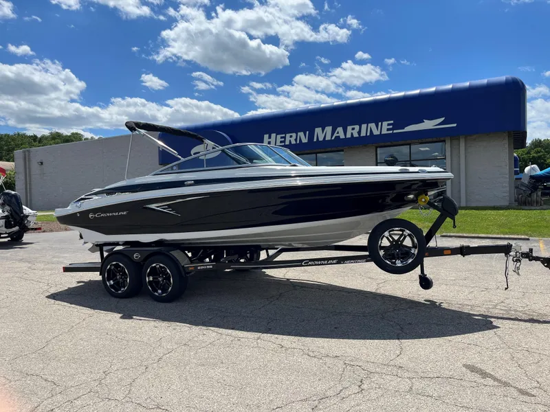 The Image of 2025 Crownline 220 SS boat on trailer at Hern Marine dealership. - 0