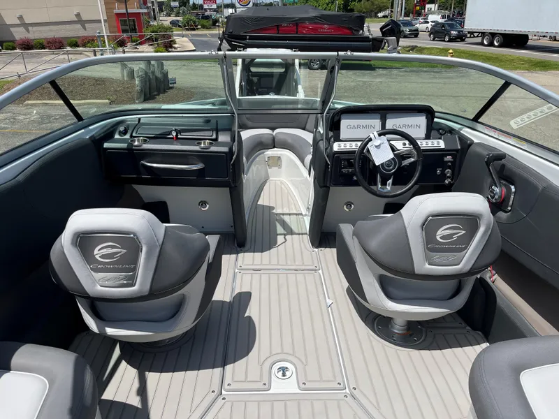 Slide: The Image of 2025 Crownline 220 SS boat interior with modern dashboard and seating. - 3