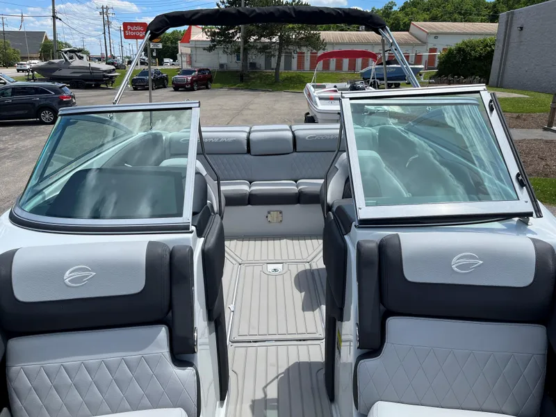 Slide: The Image of 2025 Crownline 220 SS boat interior with gray and white seating. - 5