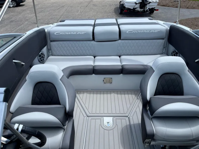 Slide: The Image of Interior of 2025 Crownline 220 SS boat with gray and black seating. - 6