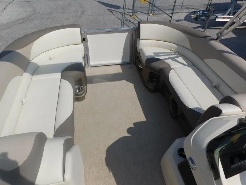 Slide: The Image of 2024 Avalon LSZ Quad Lounger boat interior with spacious seating and cup holders. - 10