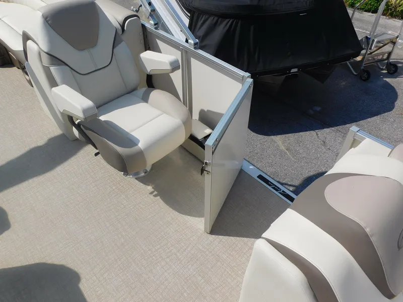 Slide: The Image of 2024 Avalon LSZ Quad Lounger boat interior with luxurious seating and open side door. - 12