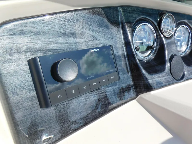 Slide: The Image of 2024 Avalon LSZ Quad Lounger dashboard with Fusion Bluetooth stereo and gauges. - 15