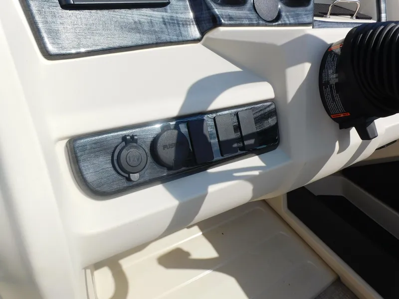 Slide: The Image of 2024 Avalon LSZ Quad Lounger dashboard controls and power outlets. - 17