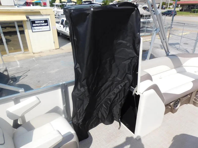 Slide: The Image of 2024 Avalon LSZ Quad Lounger boat interior with black privacy curtain. - 19