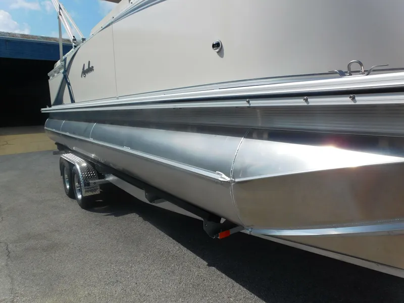 Slide: The Image of 2024 Avalon LSZ Quad Lounger pontoon boat on a trailer. - 3