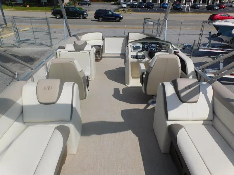 Slide: The Image of 2024 Avalon LSZ Quad Lounger interior with luxurious seating and modern helm. - 7