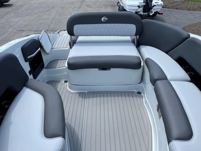 Slide: The Image of 2025 Crownline 290 SS boat interior with gray and white seating. - 11