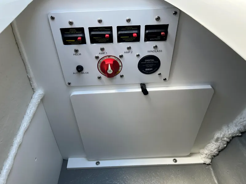 Slide: The Image of Control panel of 2025 Crownline 290 SS boat with switches and gauges. - 12