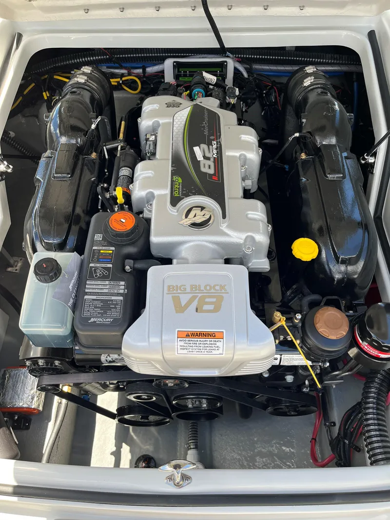 Slide: The Image of 2025 Crownline 290 SS boat engine compartment with Big Block V8 engine. - 13