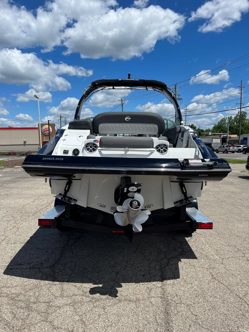 Slide: The Image of 2025 Crownline 290 SS boat rear view on a sunny day. - 14