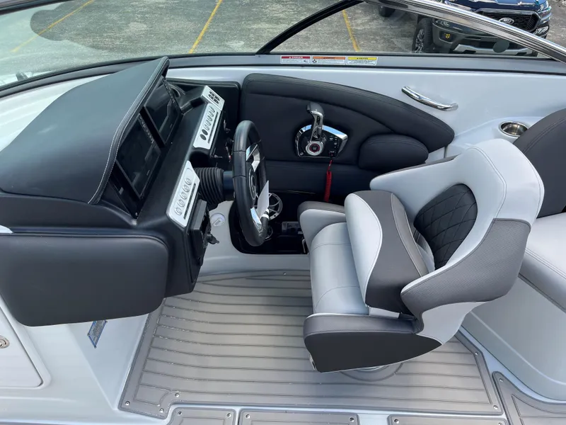 Slide: The Image of 2025 Crownline 290 SS boat cockpit with modern steering and controls. - 6