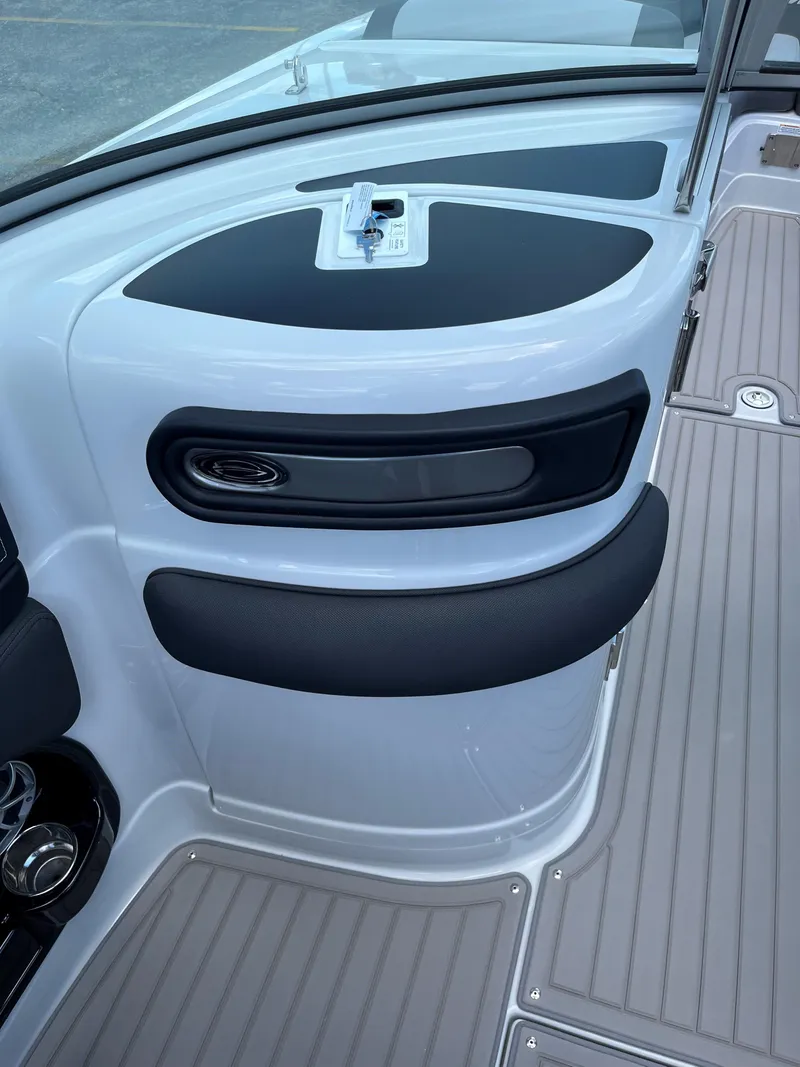 Slide: The Image of Interior view of 2025 Crownline 290 SS boat with sleek design. - 9