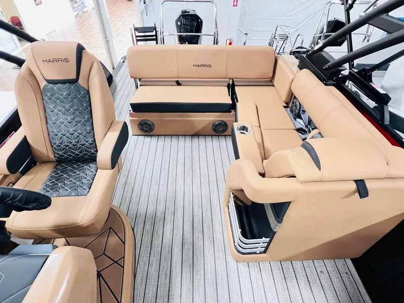 Slide: The Image of Luxurious interior of 2025 Harris Grand Mariner 230 pontoon boat with tan seating. - 10