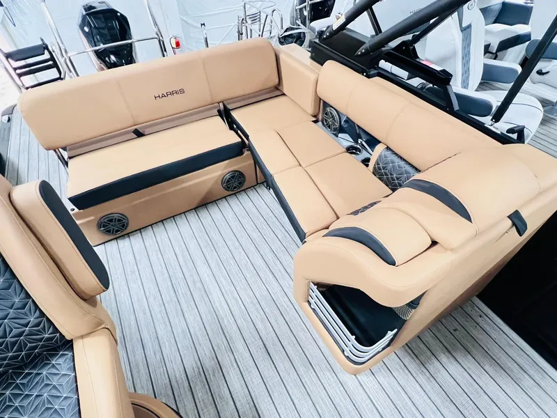 Slide: The Image of Luxurious seating on 2025 Harris Grand Mariner 230 pontoon boat, featuring tan upholstery and modern design. - 12
