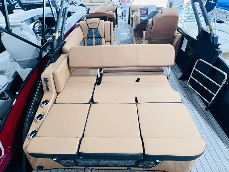 Slide: The Image of 2025 Harris Grand Mariner 230 boat interior with tan seating and modern design. - 16